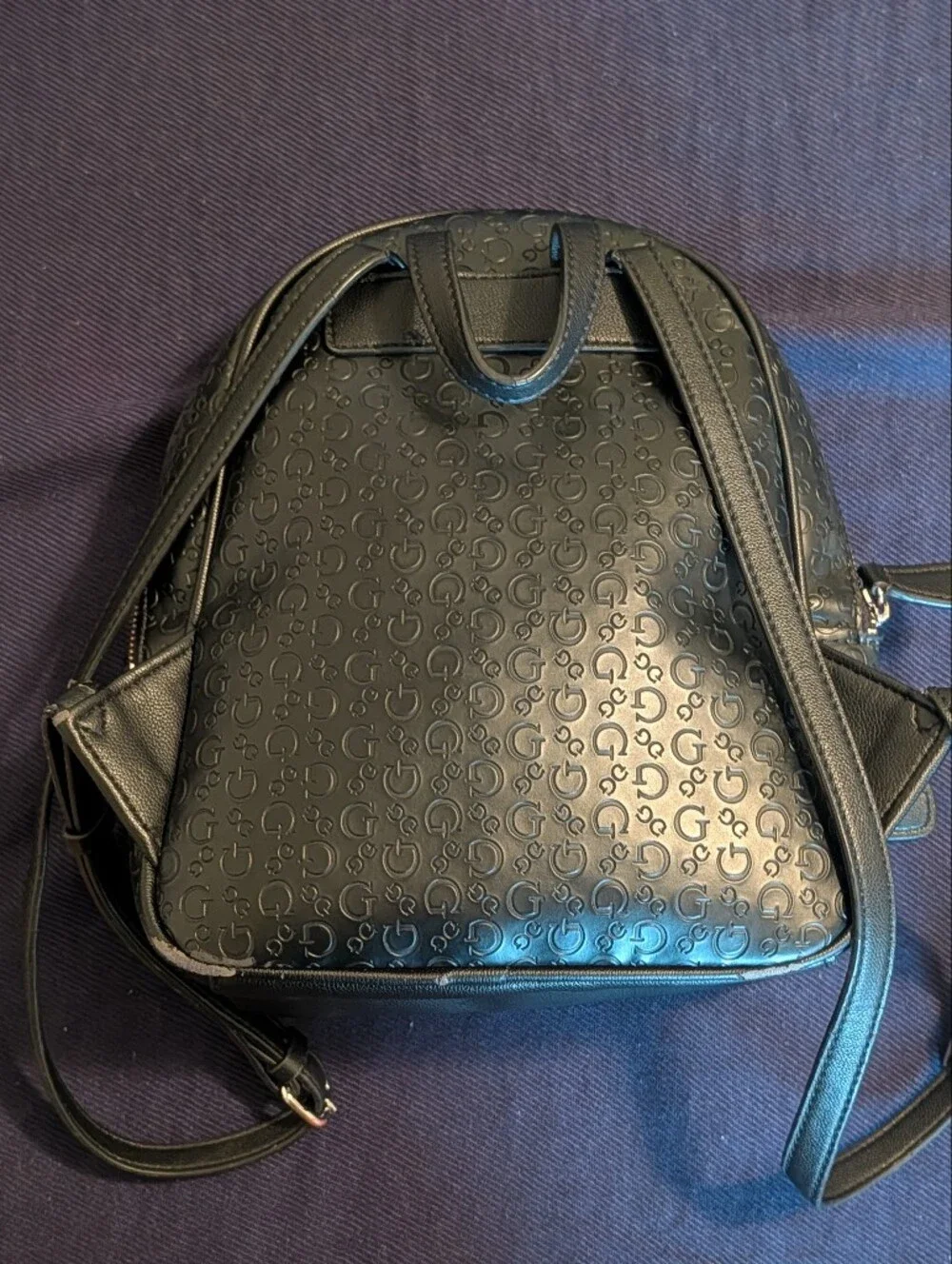 GUESS Black Embossed Logo Mini Backpack with Gold Accent